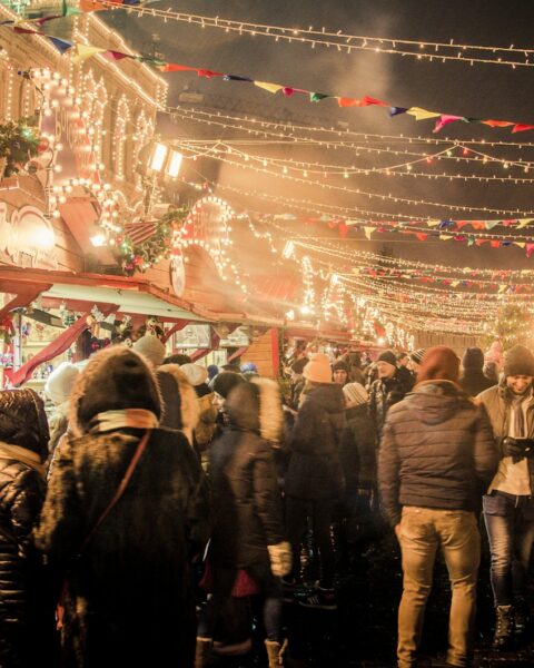 group of people standing near amusement park