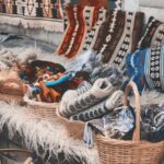 Diverse handmade textiles and crafts on display at an outdoor cultural bazaar.