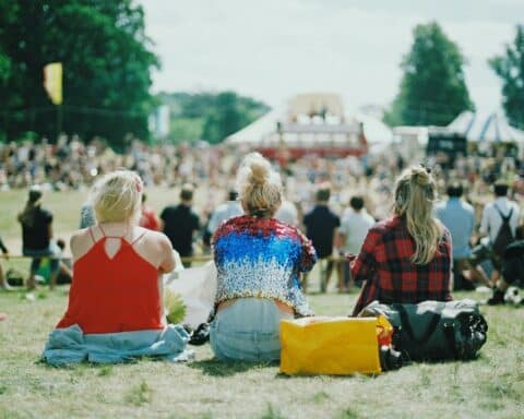 group of people on grass field under sunny day