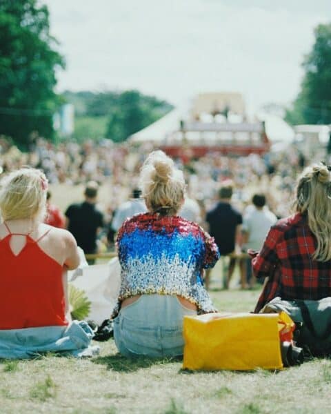 group of people on grass field under sunny day