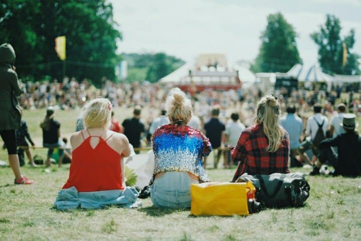 group of people on grass field under sunny day