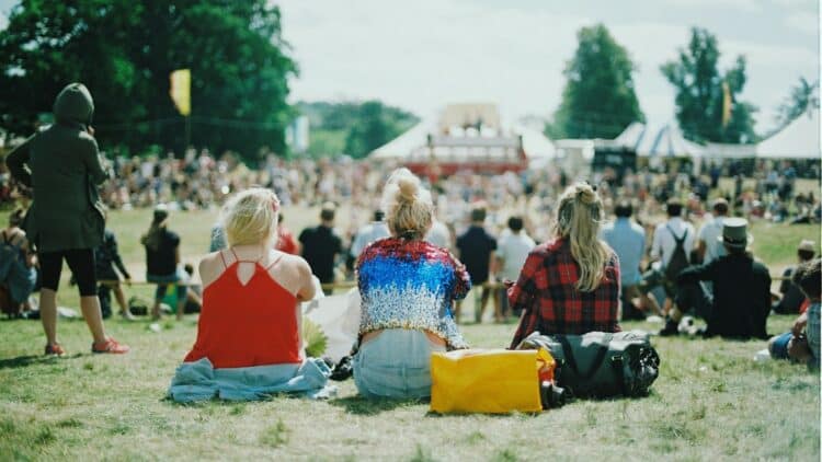 group of people on grass field under sunny day