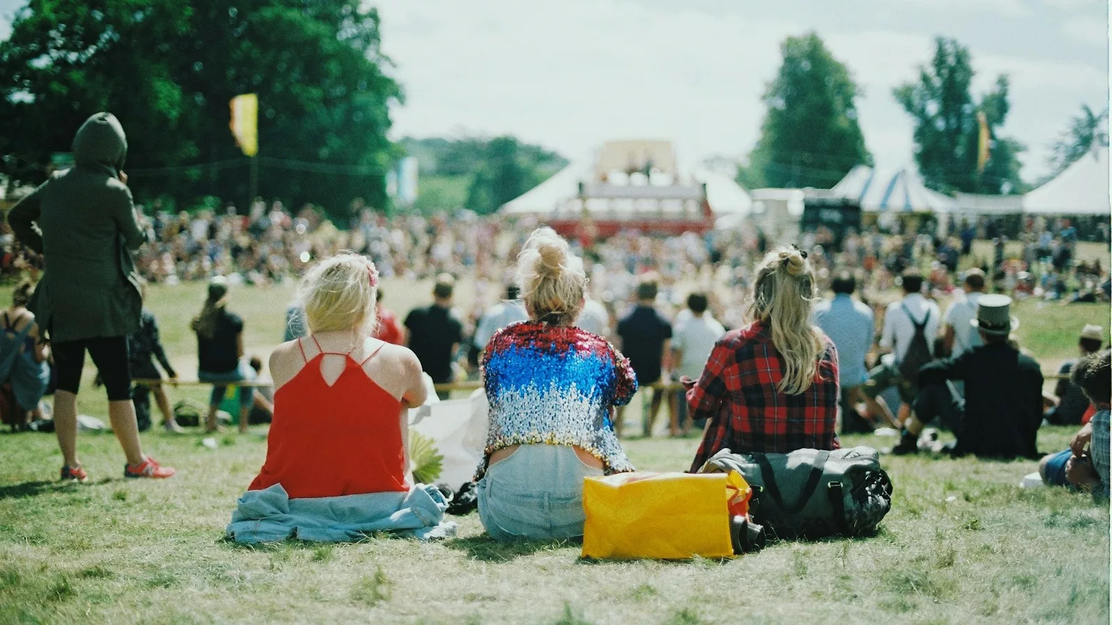group of people on grass field under sunny day